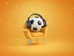 A soccer ball placed on a chair, wearing headphones